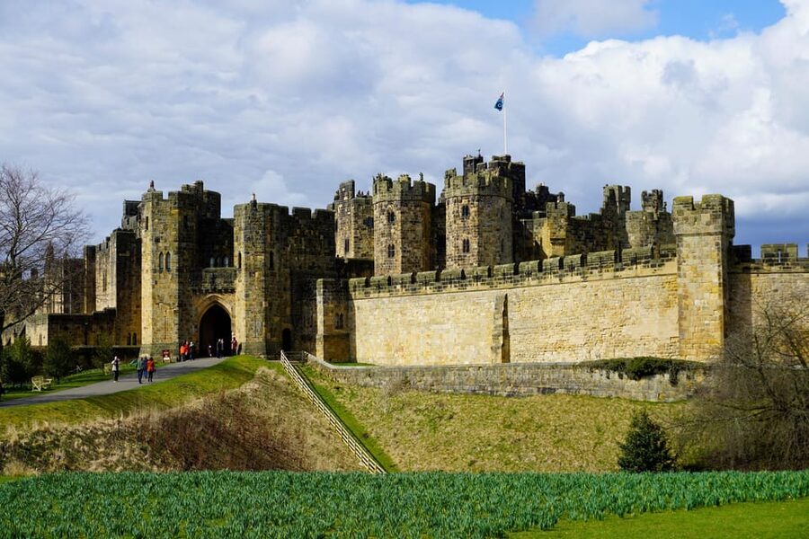 Edinburgh: Bamburgh Castle, Northumberland and Alnwick Trip - Bamburgh Castle above the North Sea