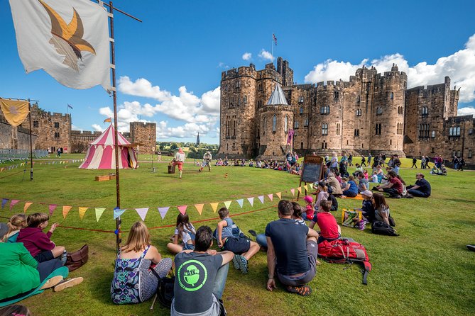 Harry Potter's Alnwick Castle and Scottish Borders Day Trip - Bamburgh Castle above the beach
